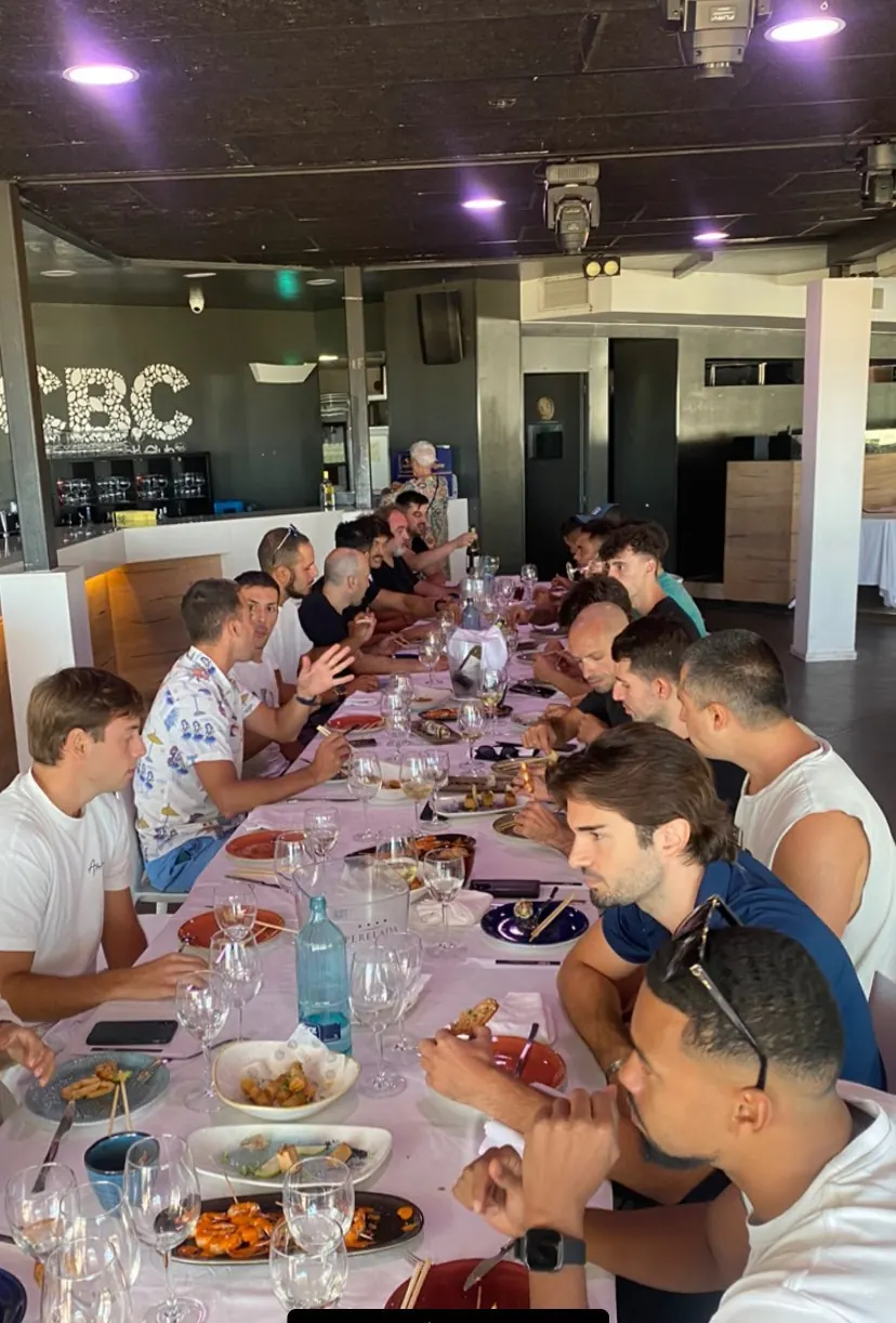 The Gamium team at a long dinner table