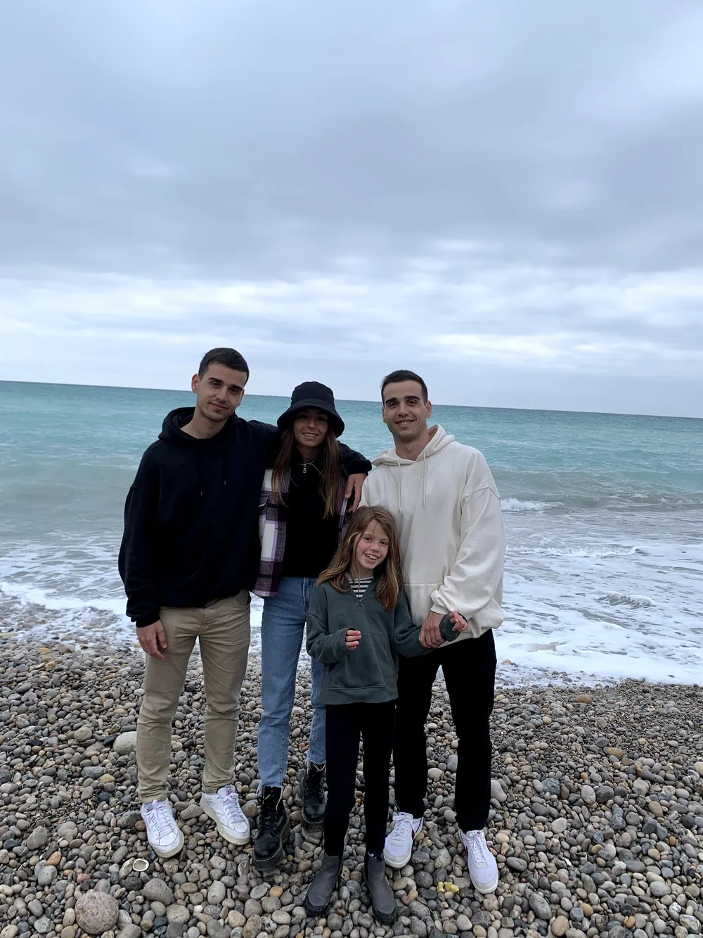 The family on a pebble beach