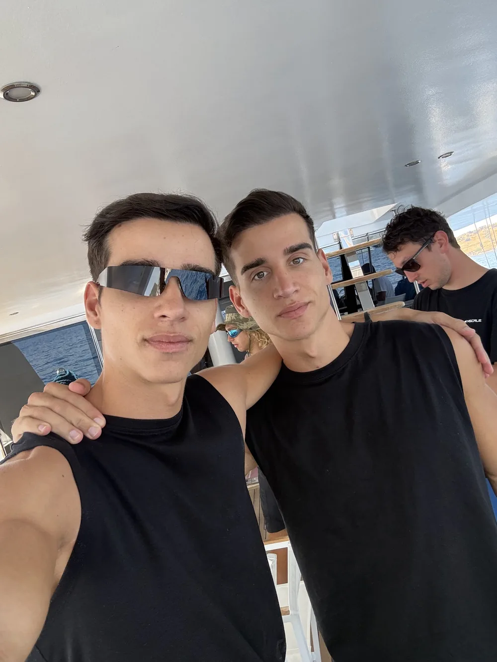 A selfie of the twins on a boat
